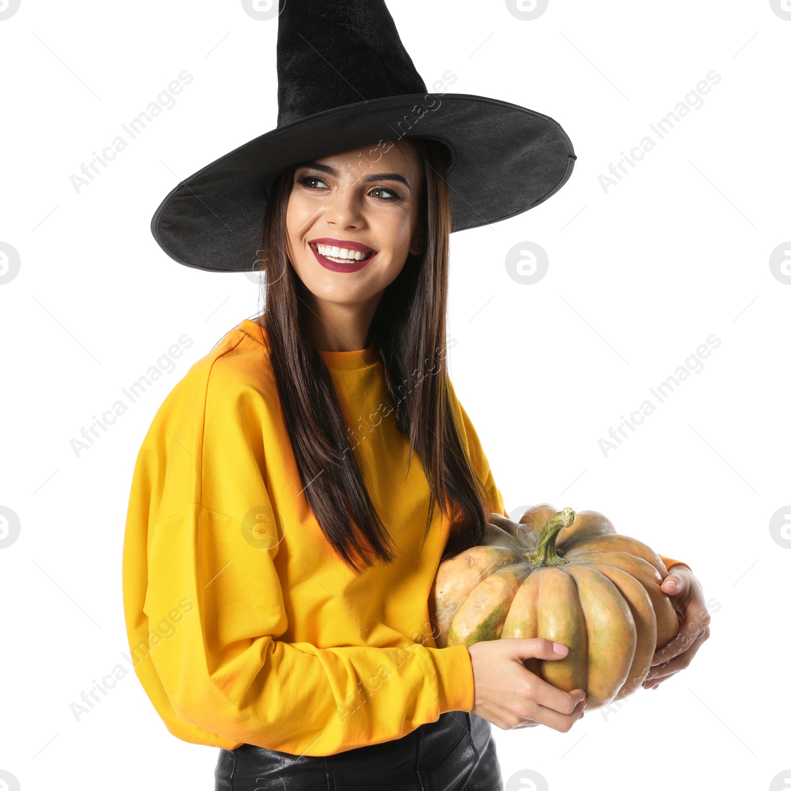 Photo of Beautiful woman wearing witch costume with pumpkin for Halloween party on white background