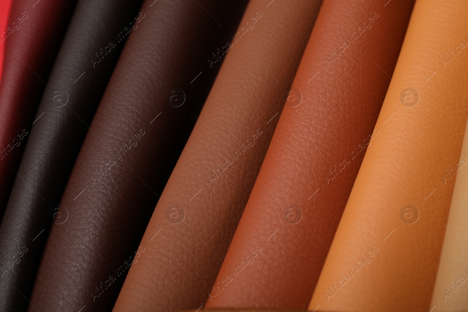 Photo of Different leather samples as background, closeup view