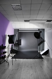 Interior of modern photo studio with professional equipment