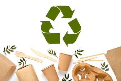 Image of Flat lay composition of eco friendly products and recycling symbol on white background