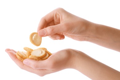 Photo of Woman holding crispy rusks on white background, closeup