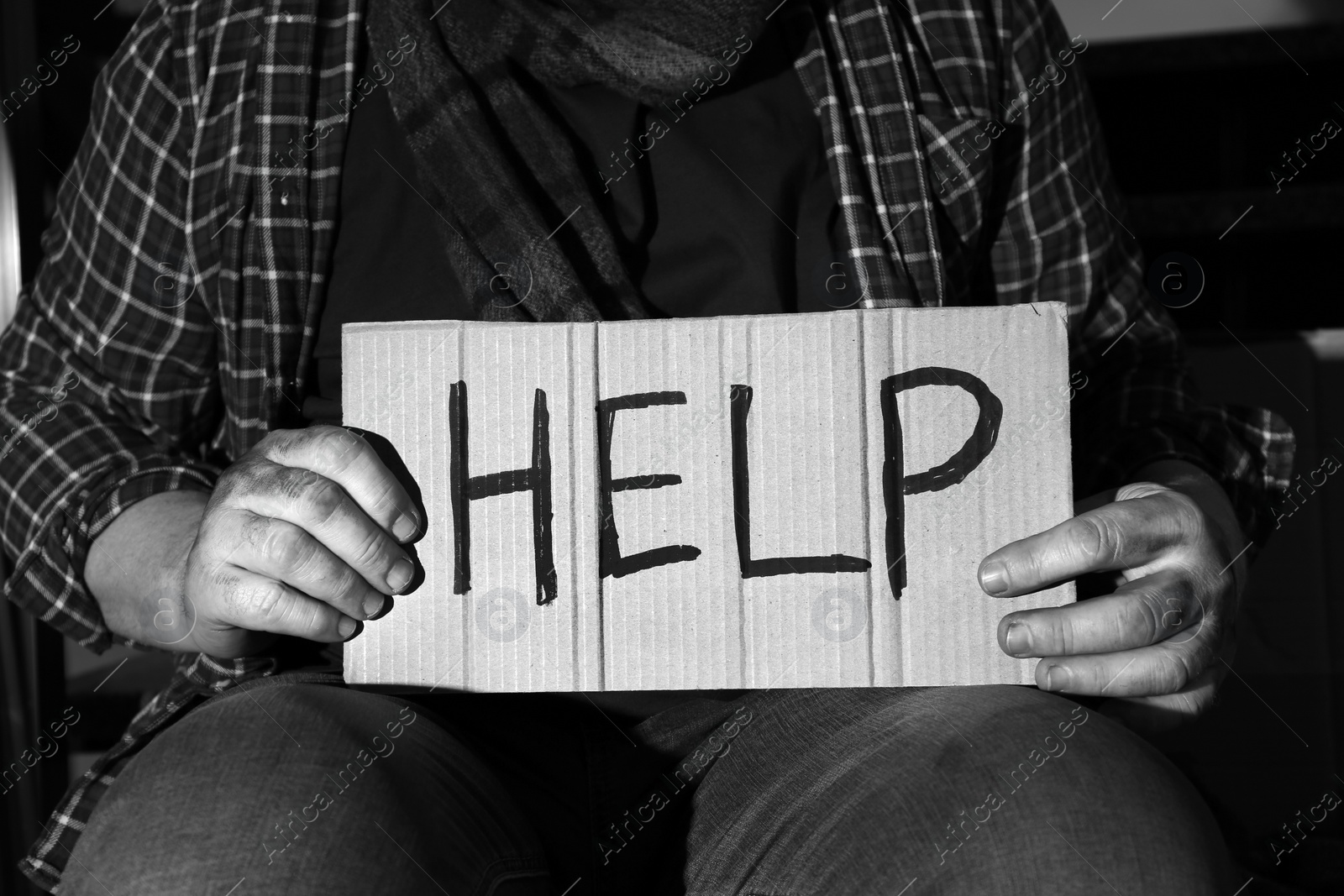 Photo of Poor senior man with cardboard sign HELP, closeup. Black and white effect