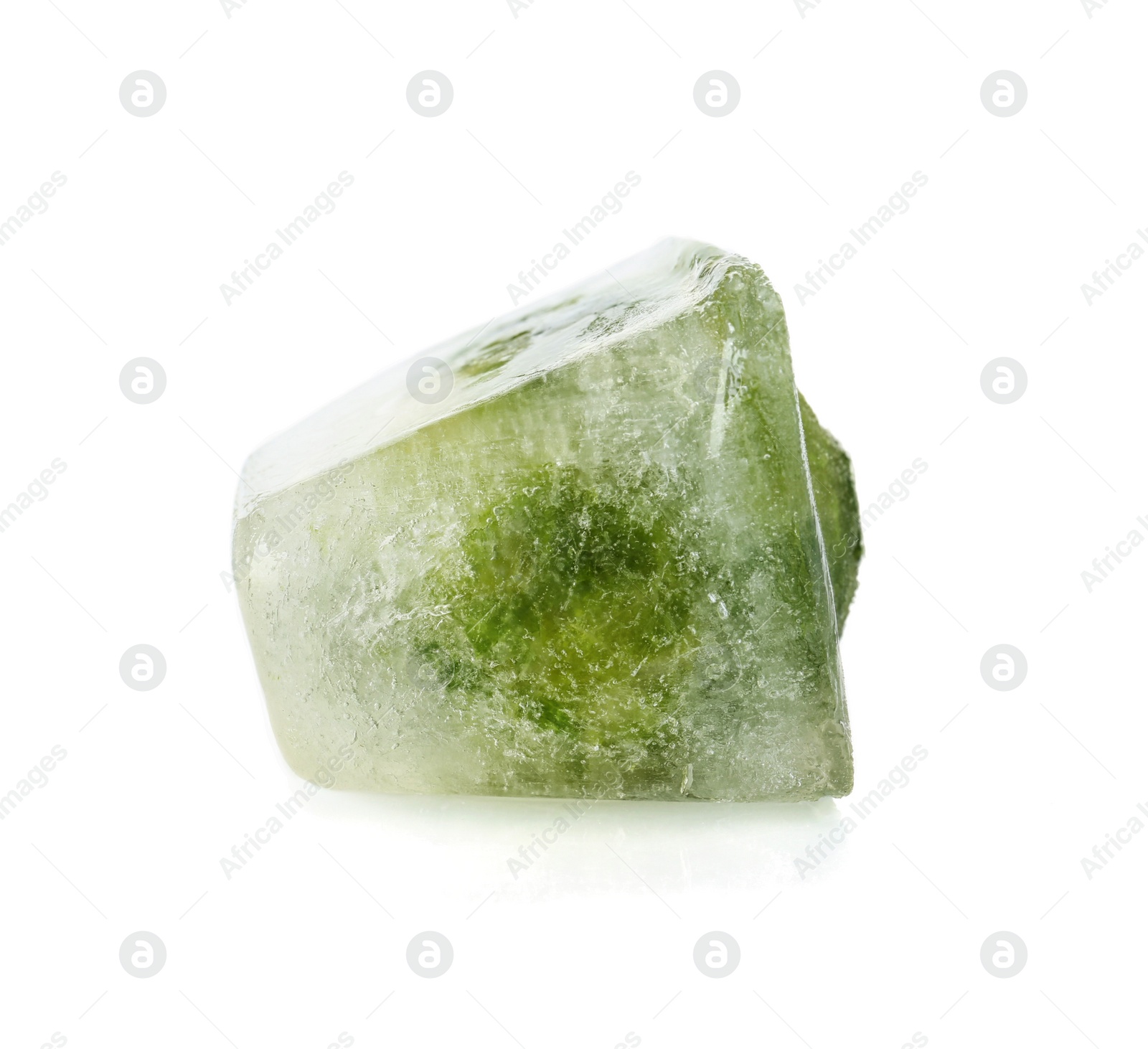 Photo of Brussels sprouts in ice cube on white background. Frozen vegetables