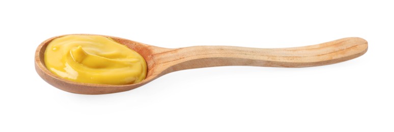 Photo of Delicious mustard in wooden spoon isolated on white