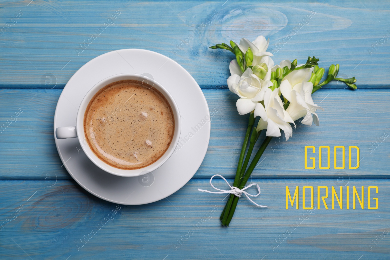 Image of Good Morning! Aromatic coffee and flowers on light blue wooden table, flat lay