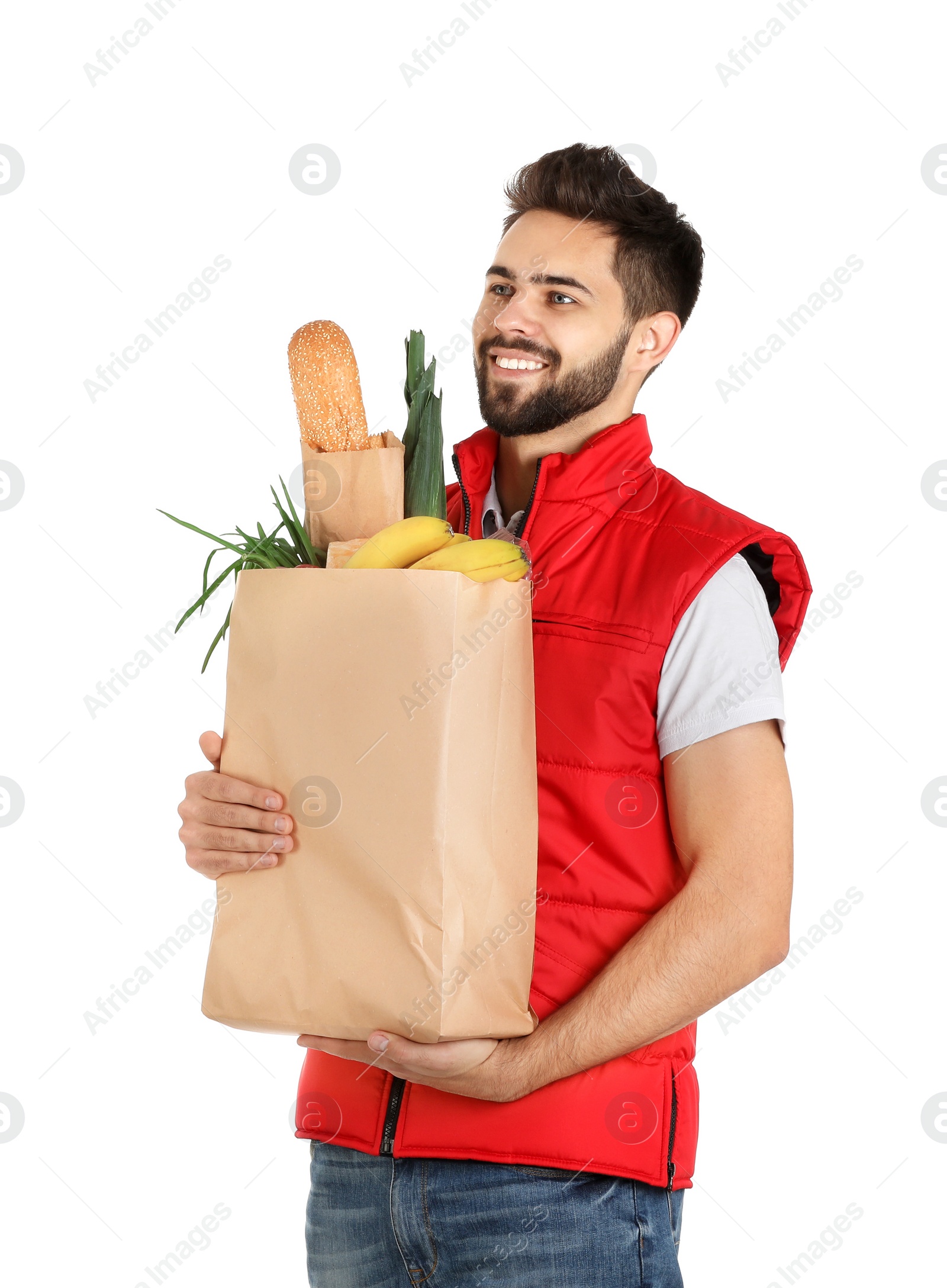 Photo of Man holding paper bag with fresh products on white background. Food delivery service