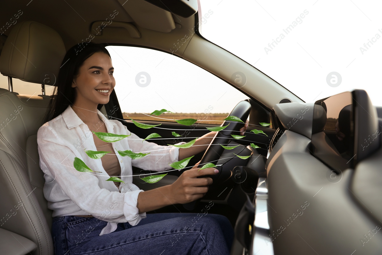 Image of Woman enjoying driving car feeling tea leaves scent from ventilation, closeup. Air freshener