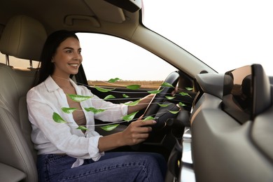 Image of Woman enjoying driving car feeling tea leaves scent from ventilation, closeup. Air freshener