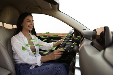 Woman enjoying driving car feeling tea leaves scent from ventilation, closeup. Air freshener