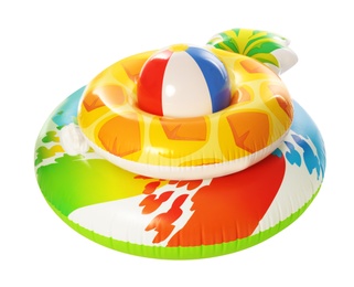 Different bright inflatable rings with beach ball on white background. Summer holidays