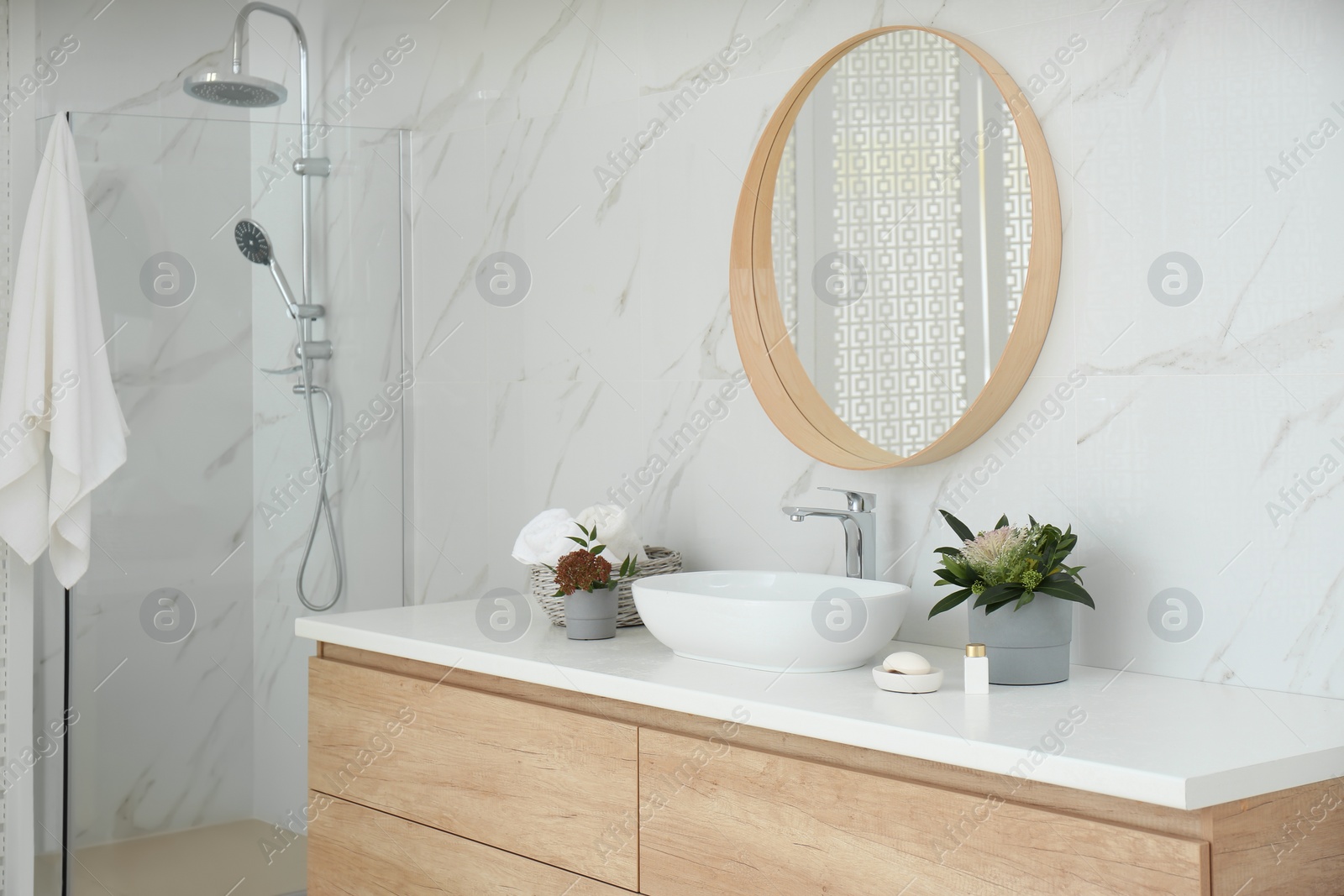 Photo of Modern bathroom interior with stylish mirror and vessel sink