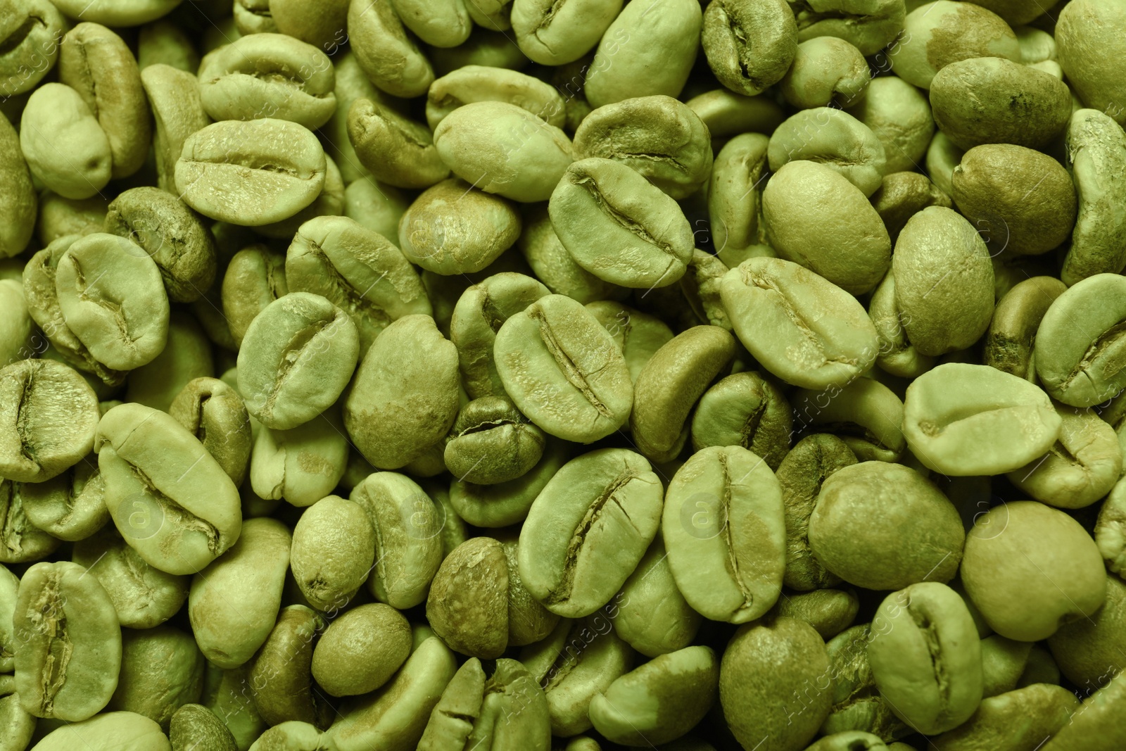 Photo of Many green coffee beans as background, top view