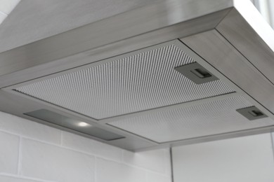 Photo of Modern range hood in kitchen, closeup view