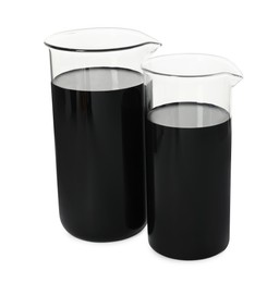 Beakers with black crude oil isolated on white