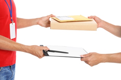 Courier giving parcel, envelope and clipboard to client on white background, closeup