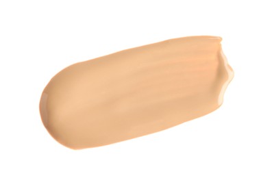 Smear of liquid skin foundation isolated on white, top view