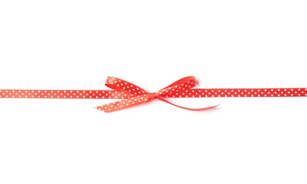 Red ribbon with bow on white background. Festive decoration