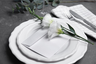 Photo of Elegant festive table setting on dark grey background