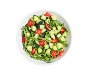 Photo of Delicious salad with cucumbers, tomatoes and sesame in bowl isolated on white, top view