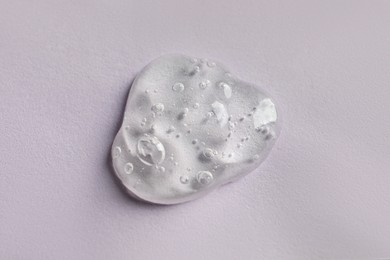 Sample of face mask on pink background, top view