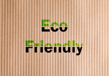 Image of Phrase Eco Friendly written on cardboard, top view