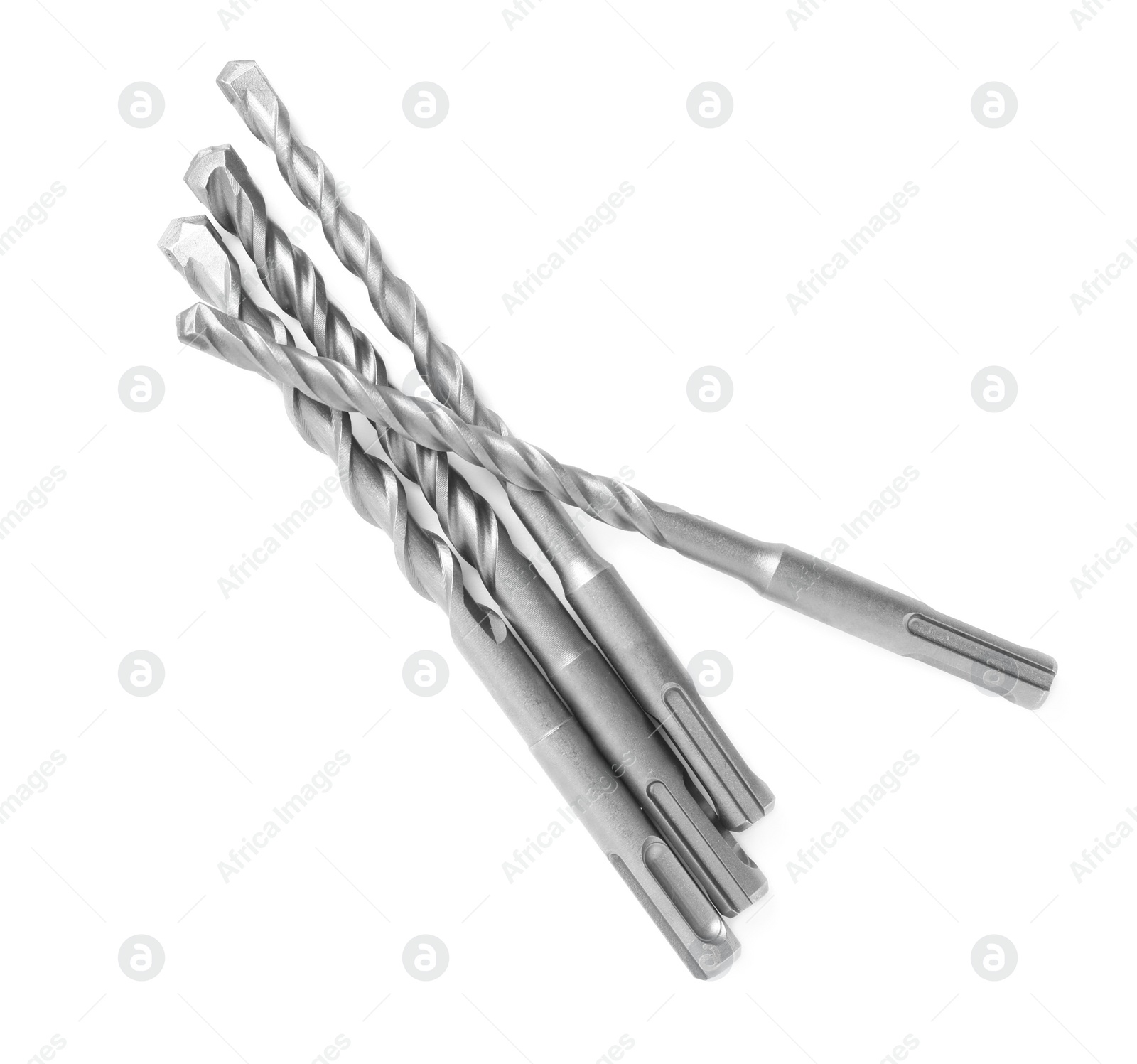 Photo of Many twist drill bits isolated on white, top view. Carpenter's tools