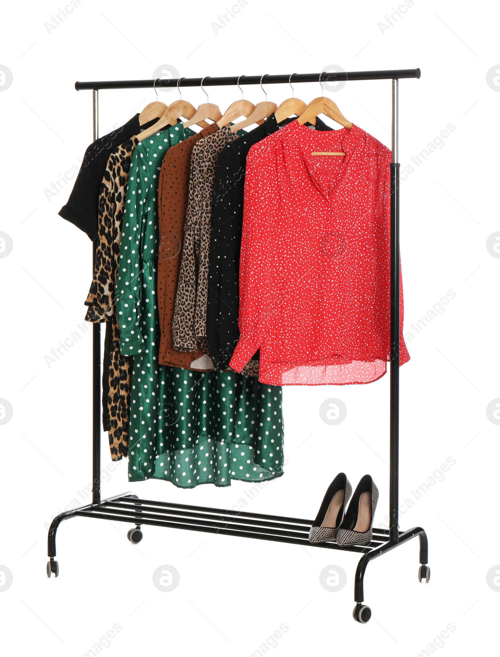 Photo of Rack with stylish women's clothes isolated on white