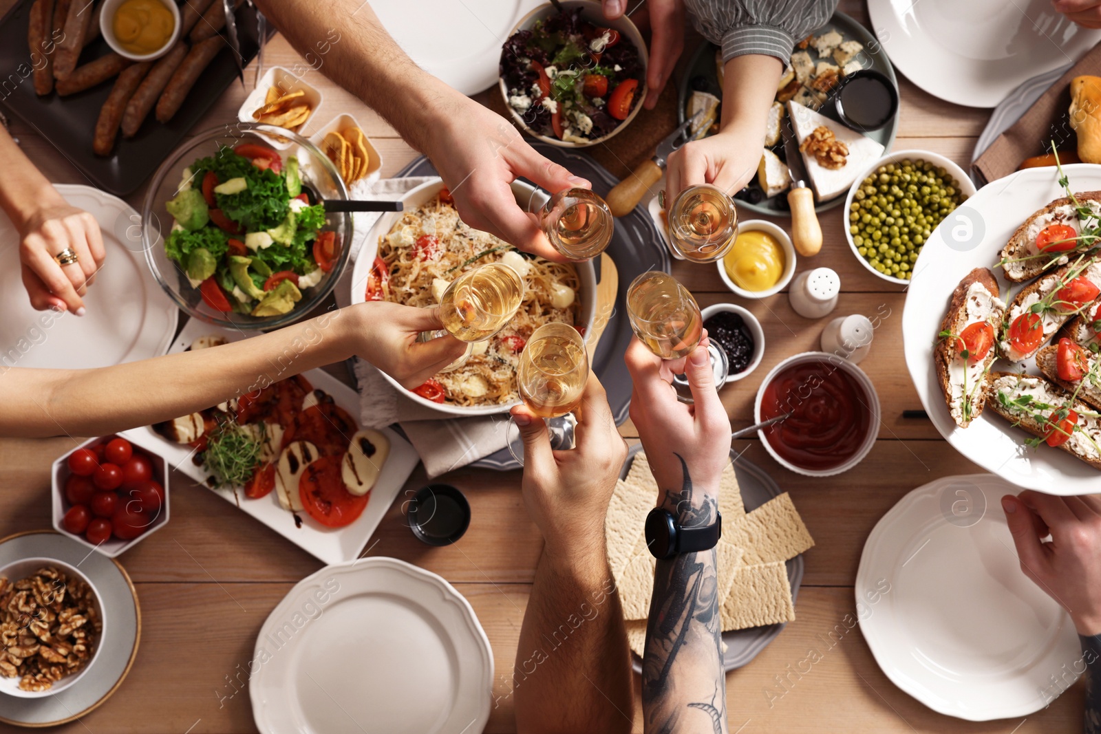 Photo of Group of people having brunch together at table, top view