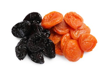 Delicious dried apricots and prunes isolated on white, top view