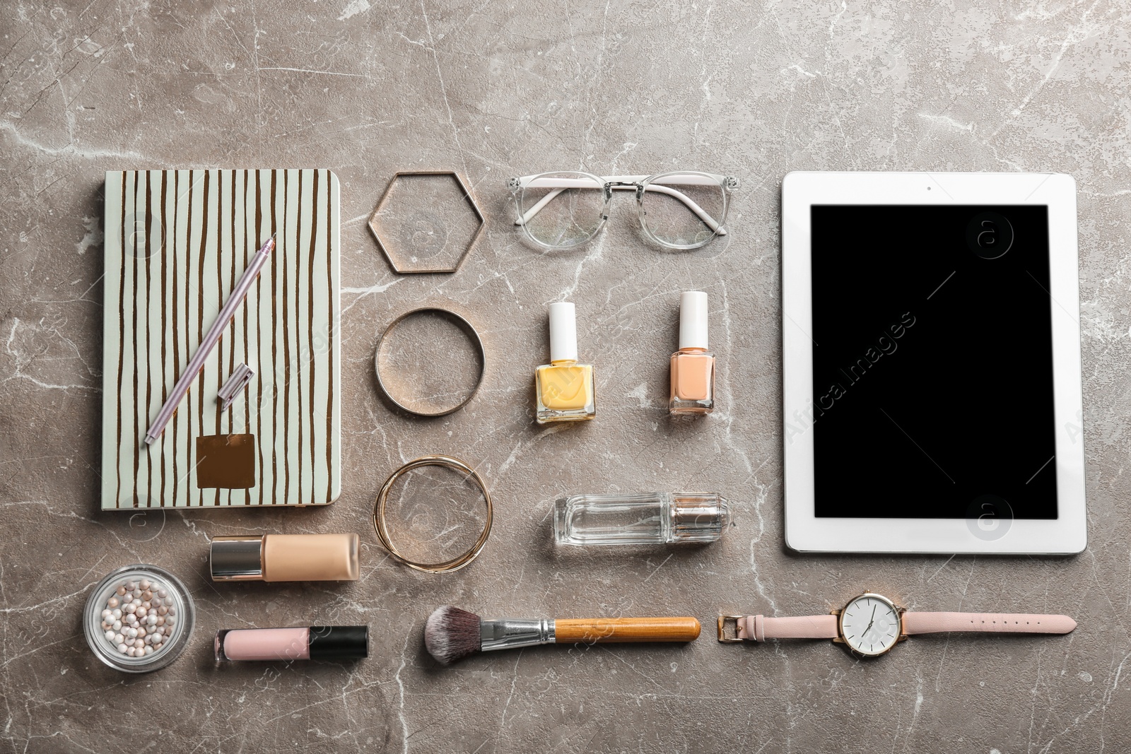 Photo of Blogger's workplace with tablet, notebook and different stuff on table, flat lay