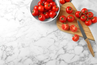 Photo of Flat lay composition with fresh cherry tomatoes on marble background. Space for text