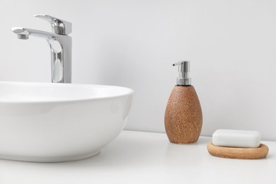 Photo of Set of different bath accessories and products on white table