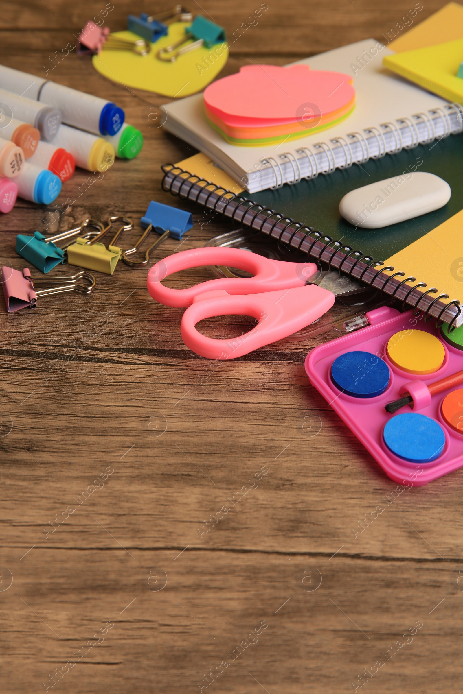 Photo of Many different school stationery on wooden table, space for text. Back to school