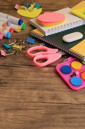 Photo of Many different school stationery on wooden table, space for text. Back to school