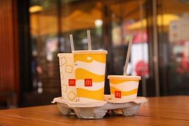 MYKOLAIV, UKRAINE - AUGUST 11, 2021: Cold McDonald's drinks on table in cafe