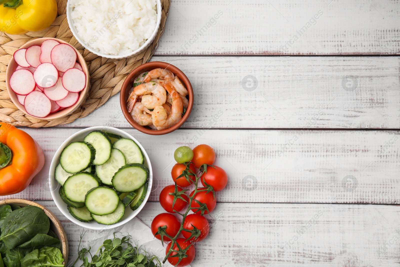 Photo of Ingredients for poke bowl on white wooden table, flat lay. Space for text