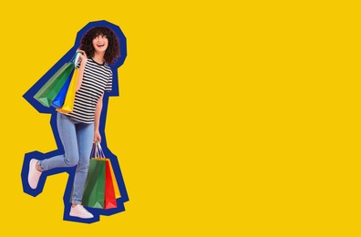 Happy woman with shopping bags on yellow background, space for text