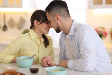 Lovely couple spending time together during breakfast at home