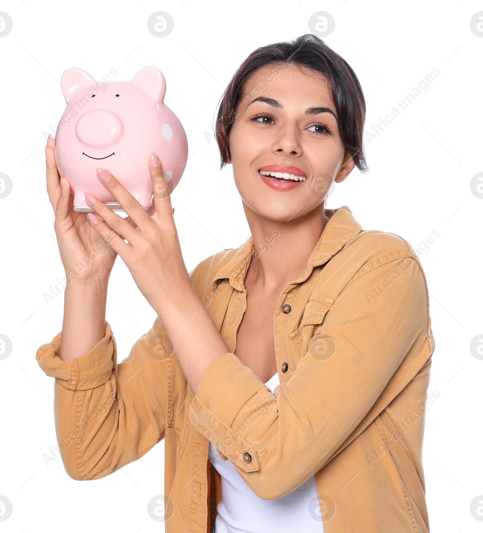 Photo of Young woman with piggy bank on white background