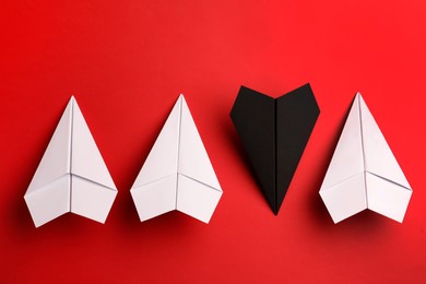 Photo of Flat lay composition with paper planes on red background