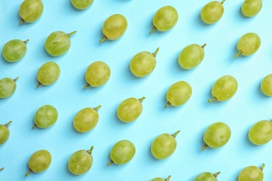 Photo of Fresh ripe juicy green grapes on color background, top view