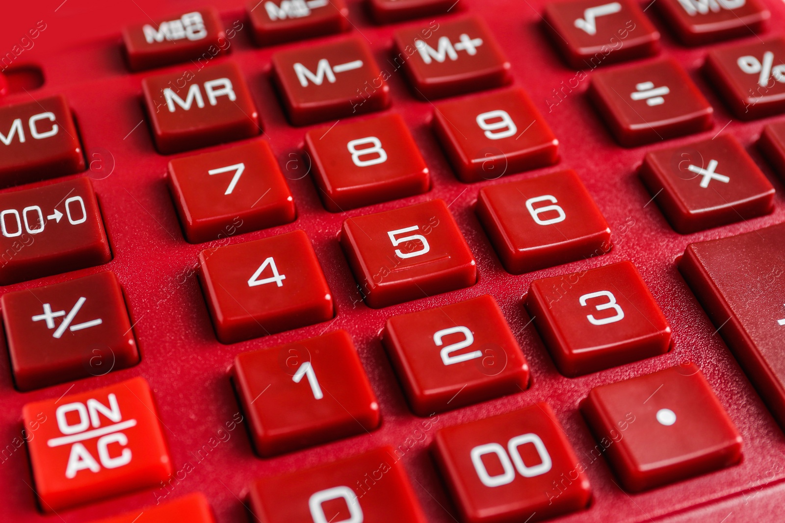 Photo of Closeup view of red calculator as background