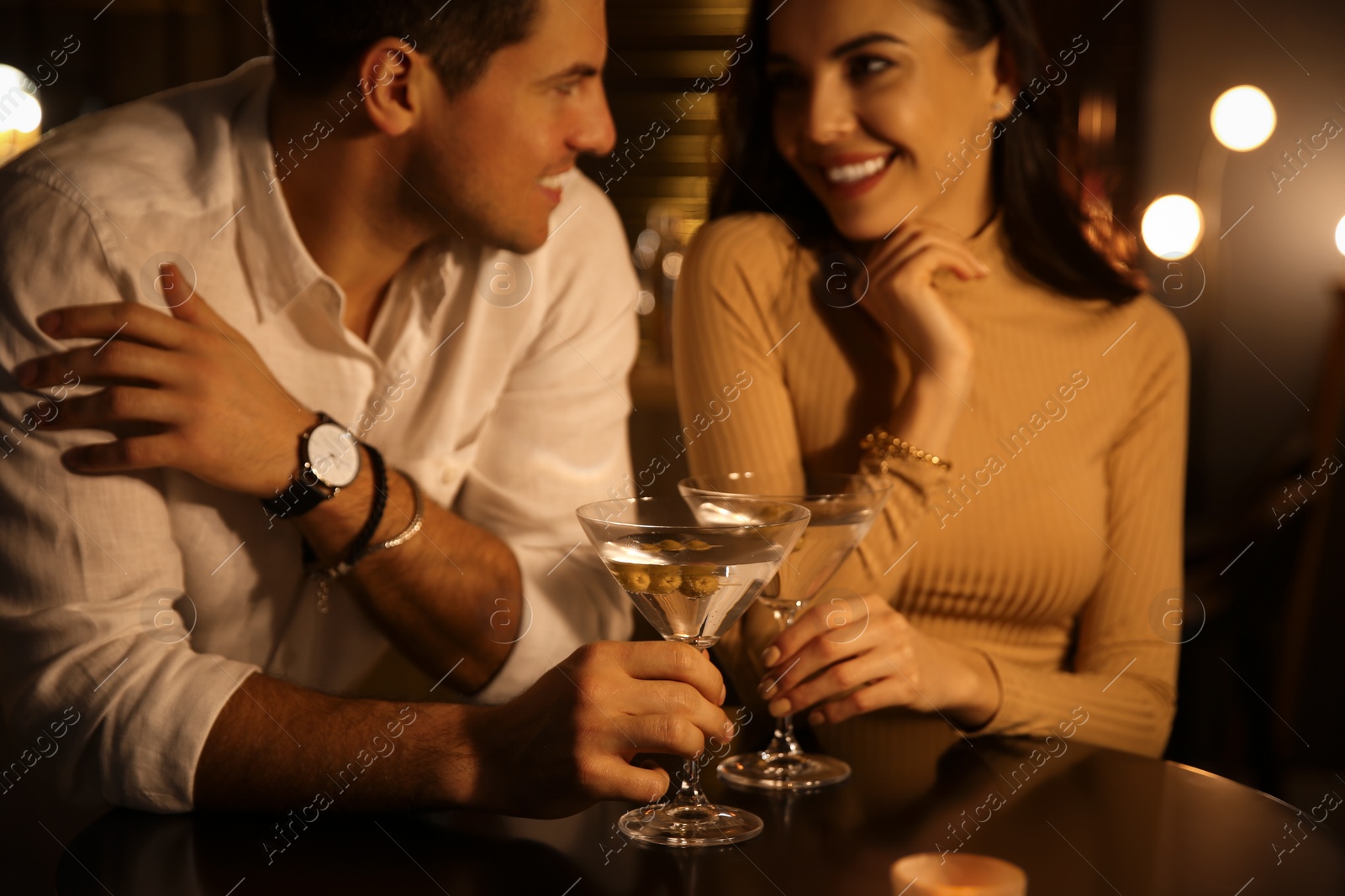 Photo of Man and woman flirting with each other in bar