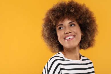 Woman with clean teeth smiling on yellow background, space for text