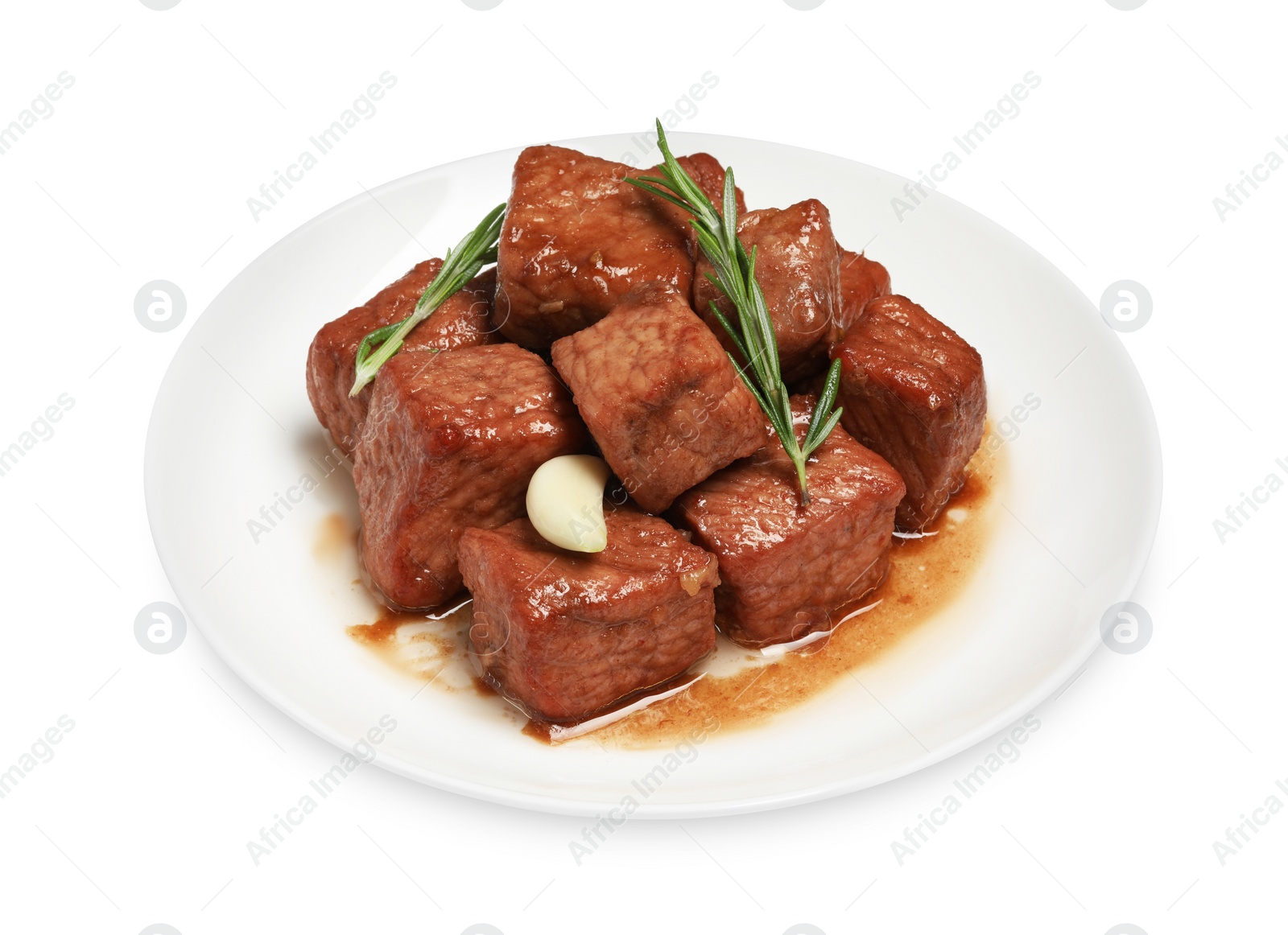 Photo of Plate with delicious cooked beef, garlic and rosemary isolated on white. Tasty goulash