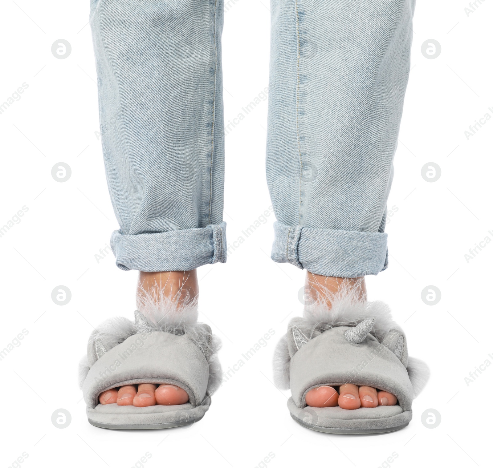 Photo of Woman in grey soft slippers on white background, closeup