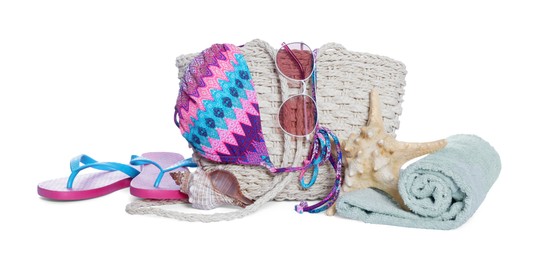 Photo of Stylish bag, starfish and other beach accessories isolated on white