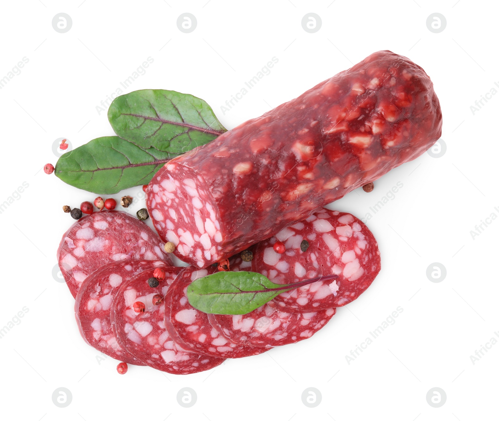 Photo of Delicious cut smoked sausage with spices isolated on white, top view