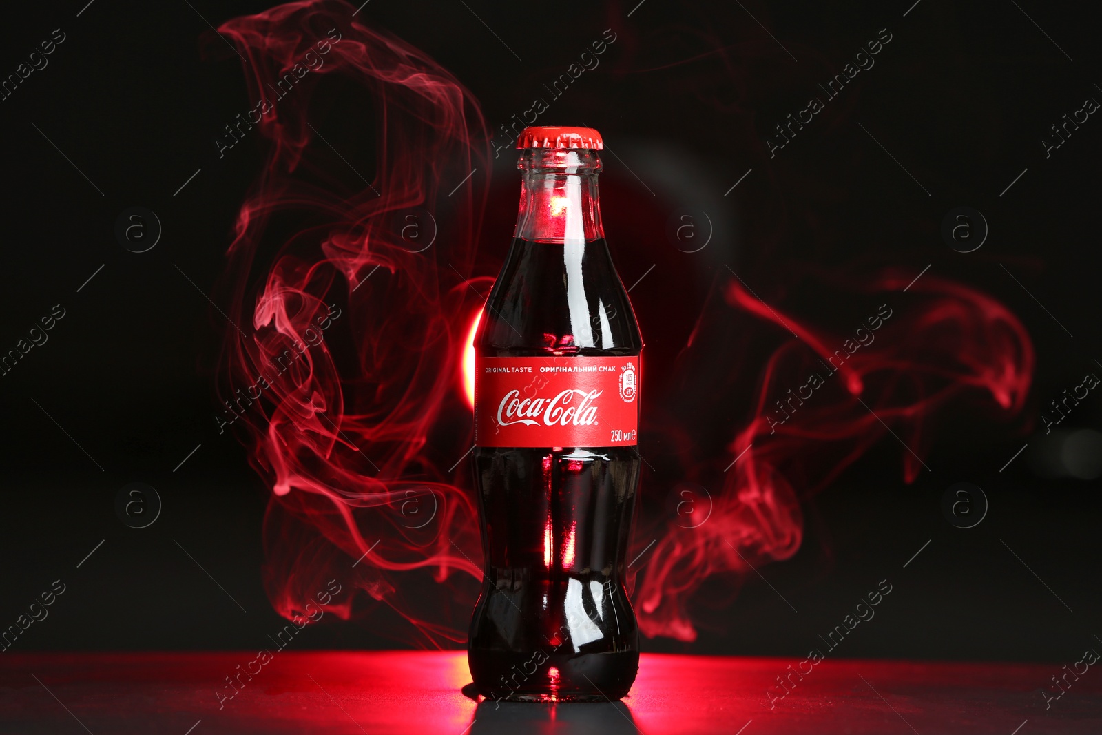 Photo of MYKOLAIV, UKRAINE - NOVEMBER 14, 2018: Bottle of Coca-Cola on dark background