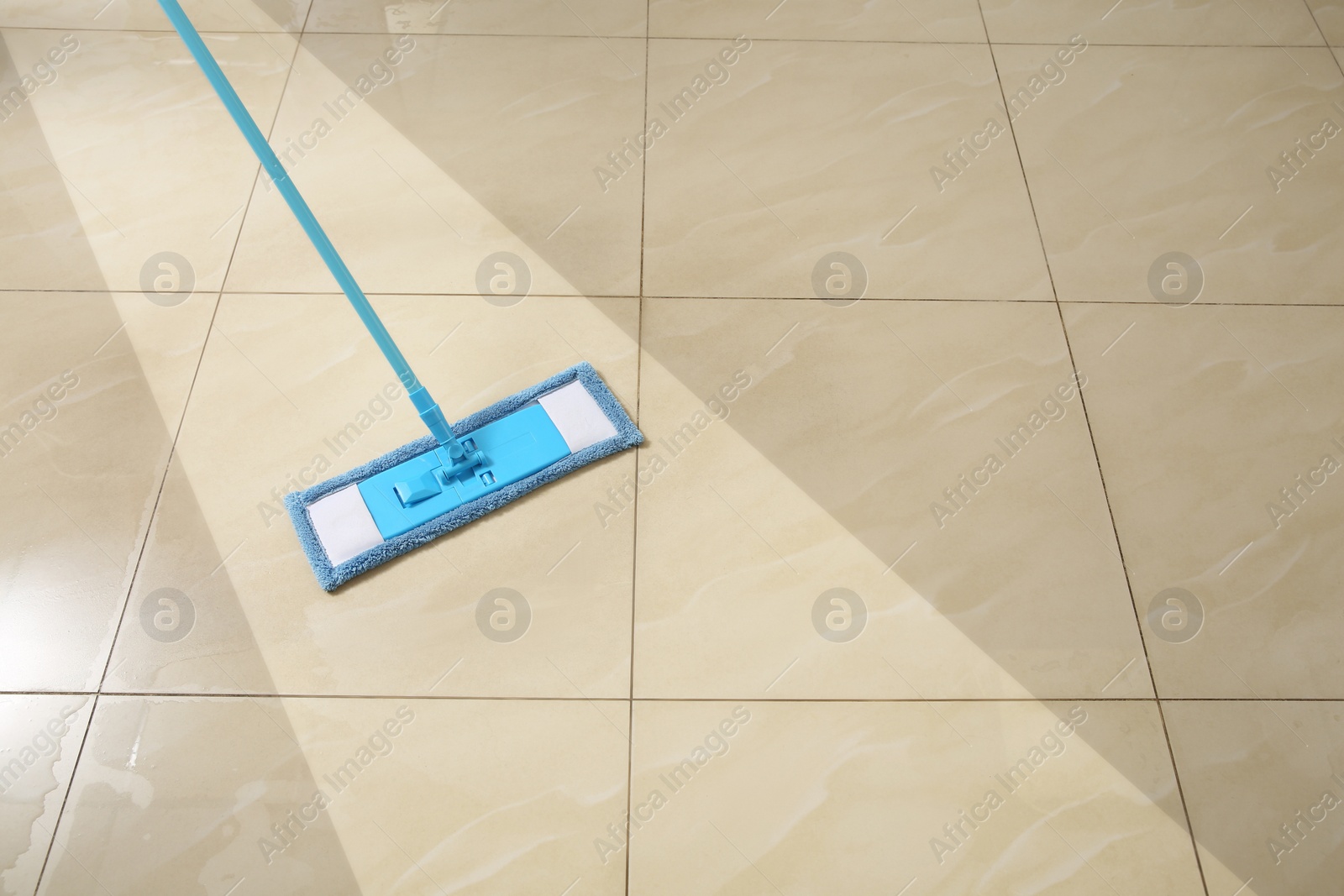 Image of Washing of floor with mop. Difference before and after cleaning